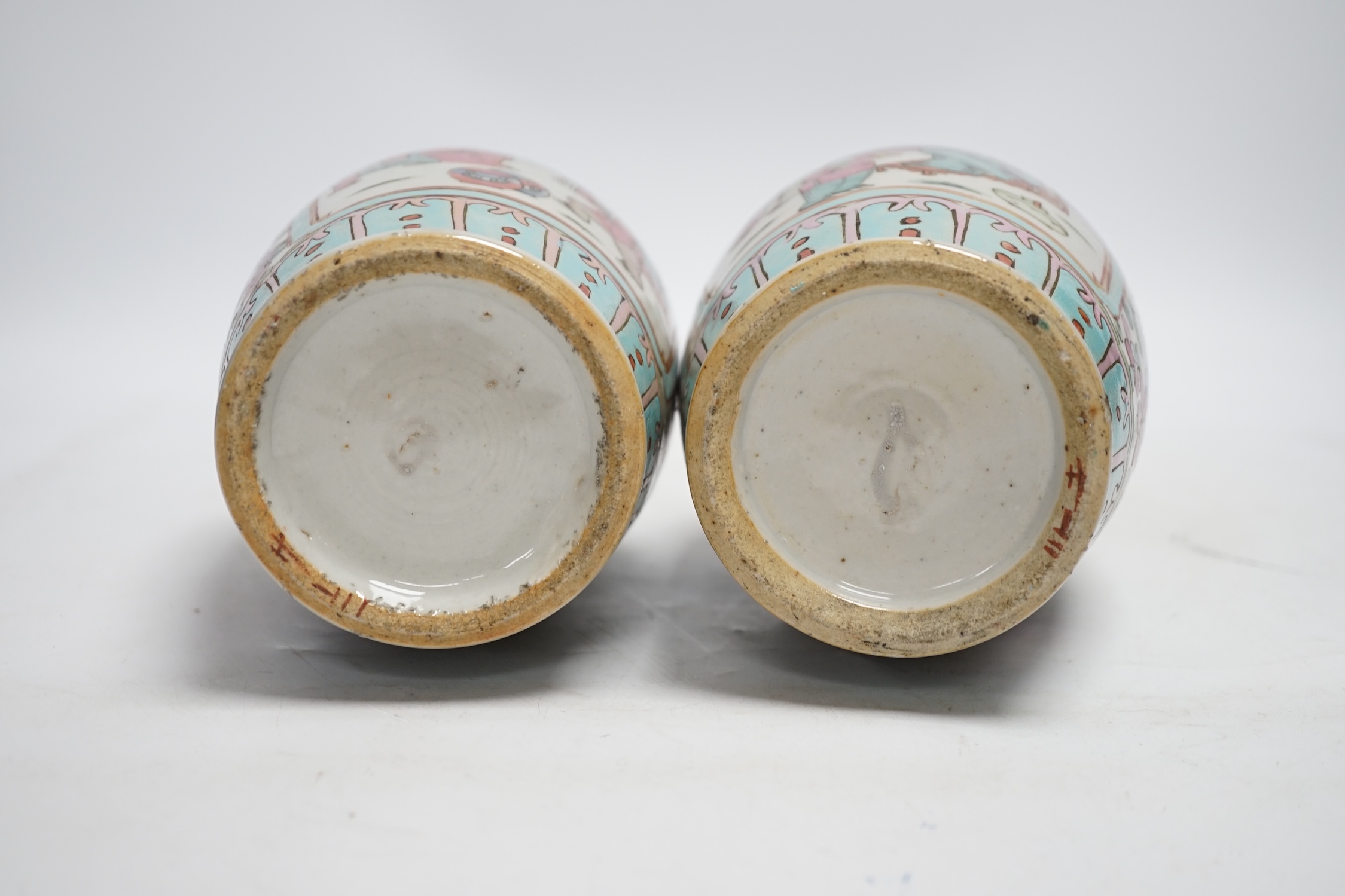 A pair of 19th century Chinese famille rose vases, 25cm high